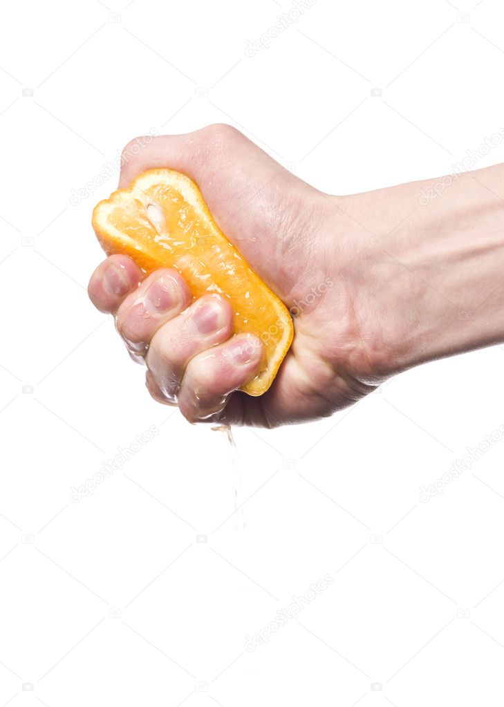 Hand squeezing an orange
