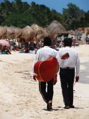 Mariachi singers on the beach clipart