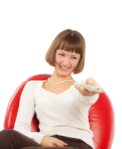 Happy young woman watching TV — Stock Photo, Image