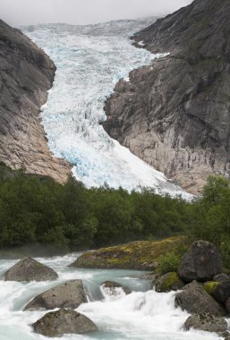 Cascading stream at Briksdal glacier clipart