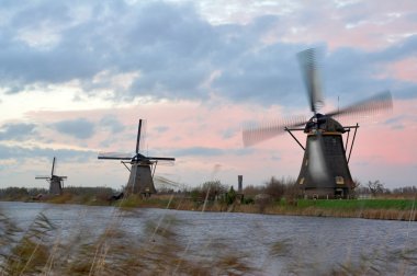 Windmills in sunset clipart