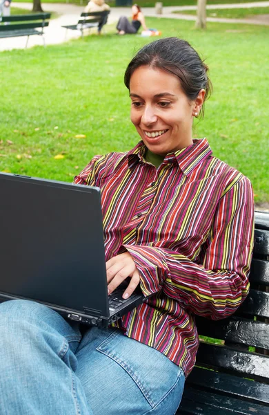 Smiling girl with computer — Stock Photo, Image