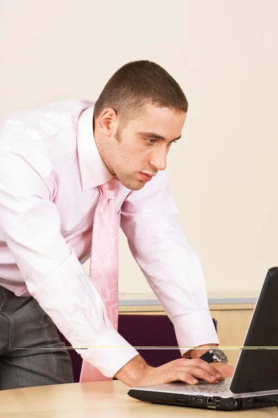 Young businessman with laptop computer — Stock Photo, Image