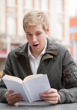 Young guy with book clipart