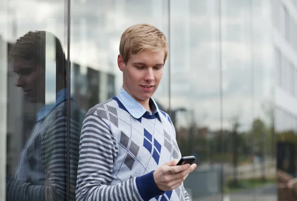 stock image Young man texting