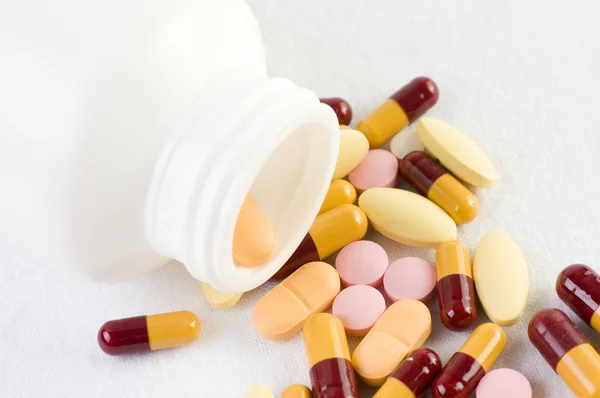 Pills spilled out of a bottle — Stock Photo, Image