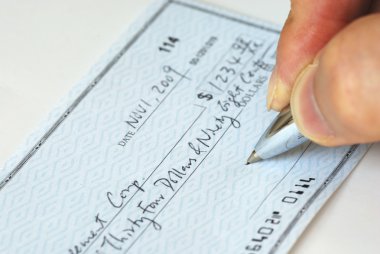 Writing a check to pay for the bill clipart