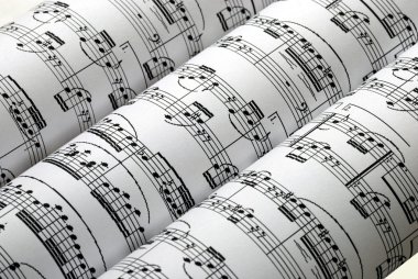 Three music sheets on a row clipart