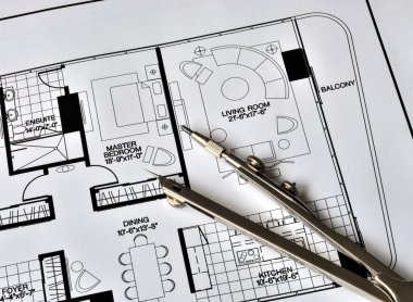 A compass on the residence floorplan clipart