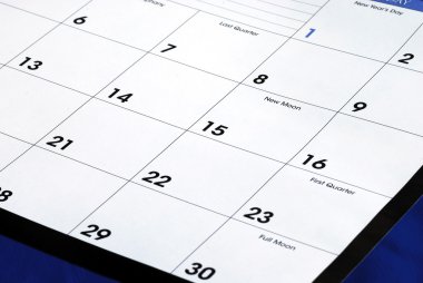 Planning the new month from a calendar clipart