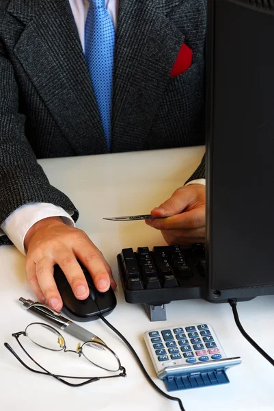 stock image A gentleman making an online purchase