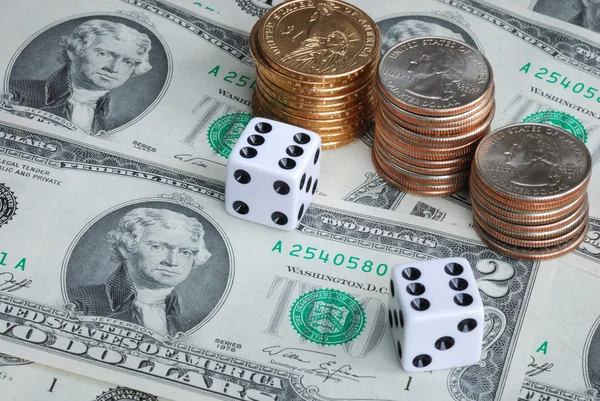 Two dices with stacks of quarters — Stock Photo, Image