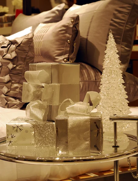 stock image Wrapped Christmas gifts on a glass table