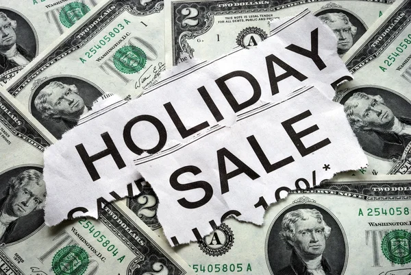 Vacanze in vendita segni con alcune banconote da $2 — Foto Stock