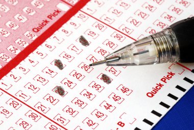 Filing the lottery ticket with a pencil clipart