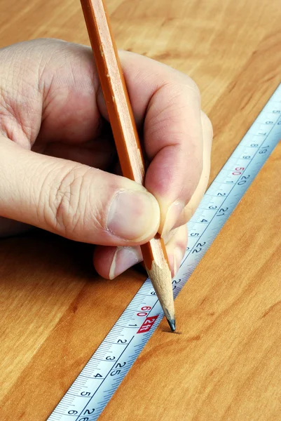 Measuring tape and pencil are tools — Stock Photo, Image