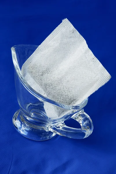 A tea bag in a glass jar — Stock Photo, Image
