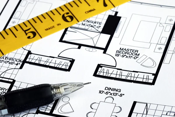 Measure the floorplan with a tape — Stockfoto
