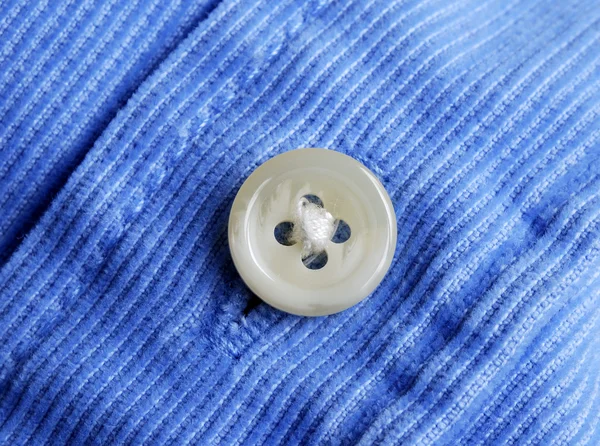 Visão de perto de um botão de uma camisa — Fotografia de Stock