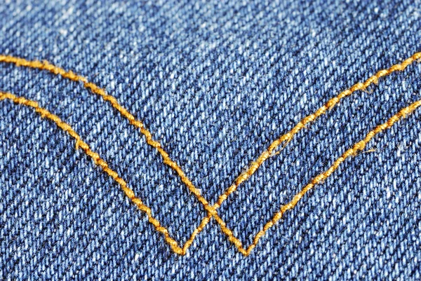Denim material with curry seams — Stock Photo, Image