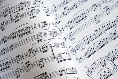 Viewing of two music sheets clipart