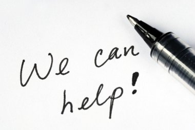 The words We Can Help on a white paper