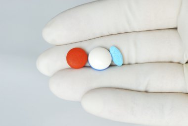 Holding some pills to the patient clipart