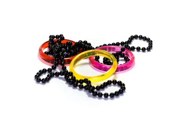 Three colour rings and necklace — Stock Photo, Image