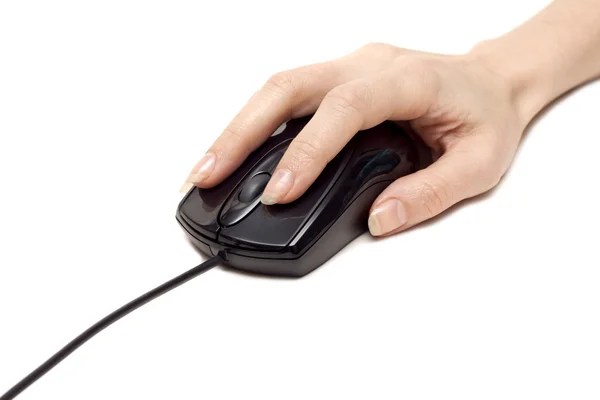 Feminine hand keeps computer mouse — Stock Photo, Image