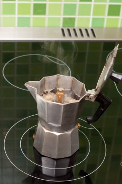 Coffee-maker boils coffee clipart