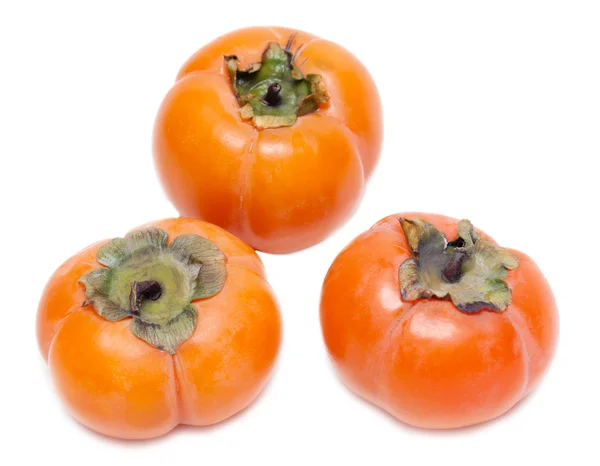 Three ripe persimmons — Stock Photo, Image