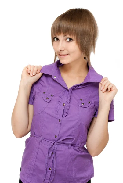Jonge meisje in violet blouse kijkt — Stockfoto