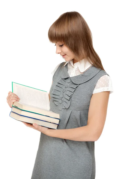Młoda dziewczyna czyta książki — Zdjęcie stockowe