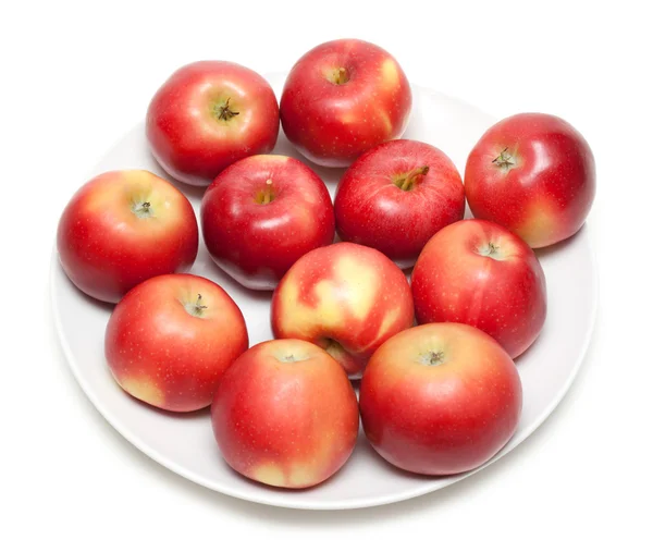 Czerwone jabłko na talerzu — Zdjęcie stockowe