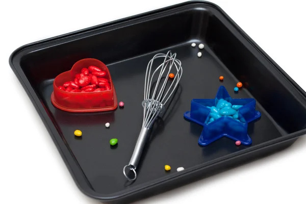 Form for baking, plastic red heart — Stock Photo, Image