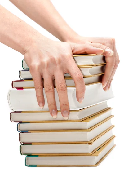 Las manos femeninas guardan la pila de libros — Foto de Stock