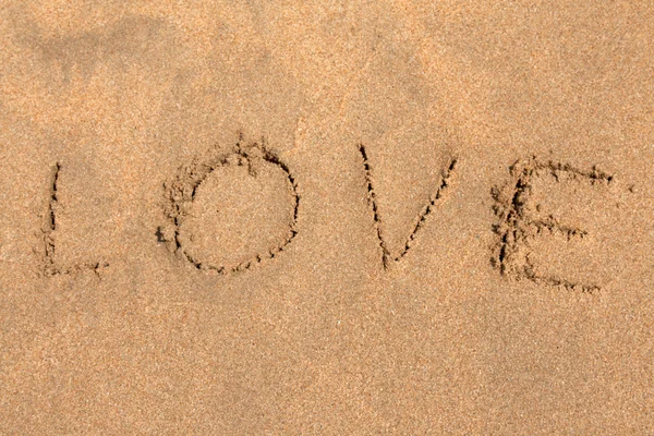 Inscription on sand LOVE — Stock Photo, Image