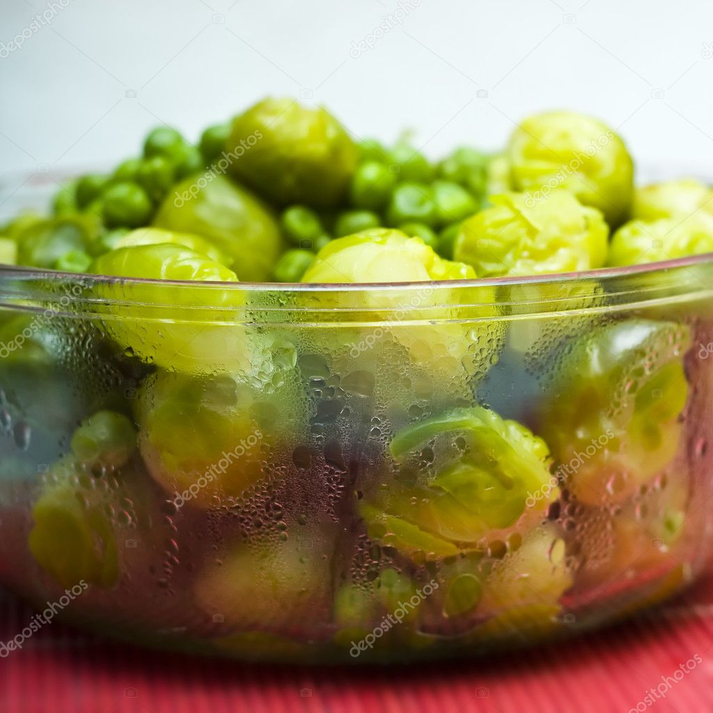 Bowl of freshly steamed peas and vegetab
