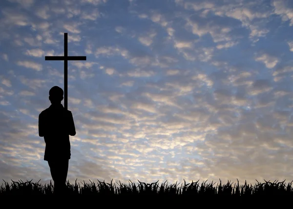 Молодой человек с крестом — стоковое фото