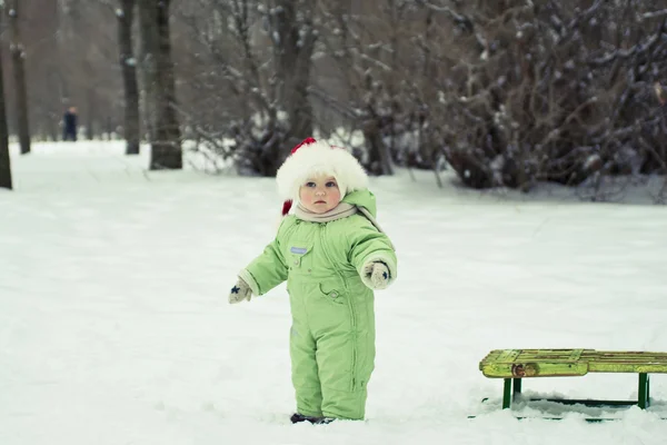 Little girl with the sled — Stock Photo, Image