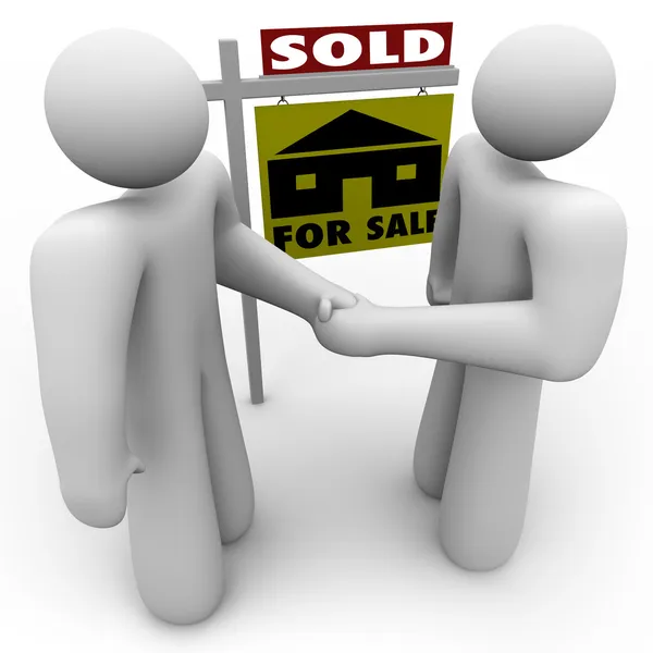 Köparen och säljaren handskakning - för försäljning tecken — Stockfoto