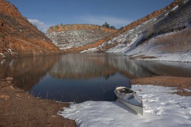 Canoe and Colorado mountain lake clipart