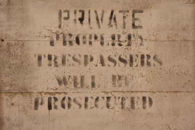 Private property sign on concrete clipart
