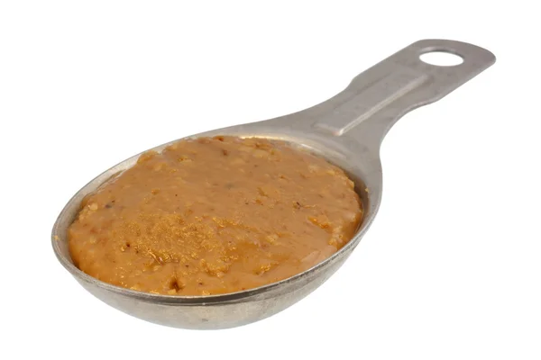Tablespoon of creamy peanut butter — Stock Photo, Image