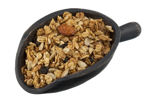 Scoop of granola with nuts, seeds — Stock Photo, Image