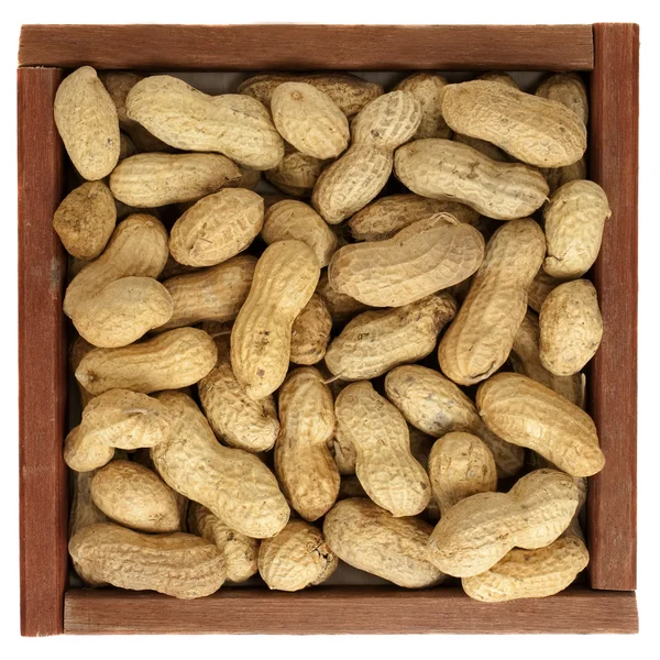 Peanuts in a rustic, wooden box — Stock Photo, Image