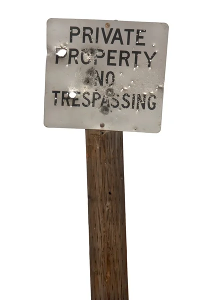 No trespassing sign with bullet holes — Stock Photo, Image