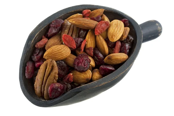 Scoop of healthy nuts and dried berries — Stock Photo, Image