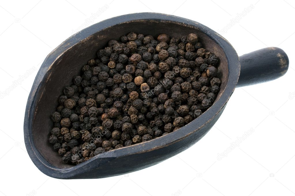 Scoop of black peppercorns