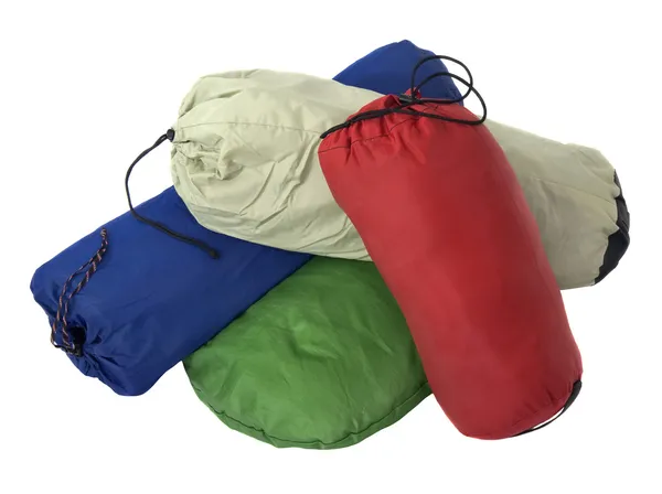 Kleurrijke tassen met kampeeruitrusting — Stockfoto
